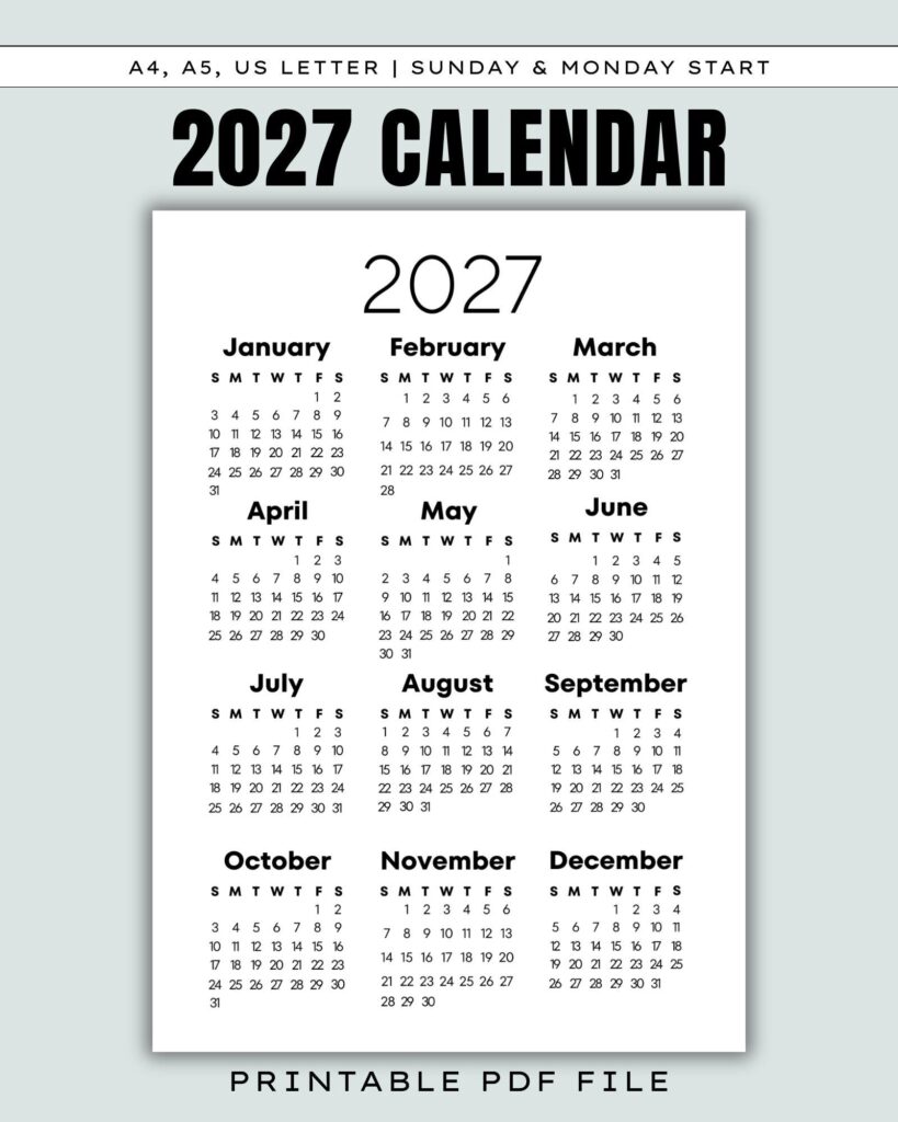 Desk with an open printable calendar spread and colorful sticky notes